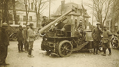 Scene from the video showing soldiers surrounding a canon, World War 1