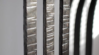 Scene from the video showing a detail of the console table's cast iron base.