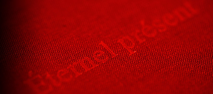 Detail of the cover of the Eternal Present album on red cloth.