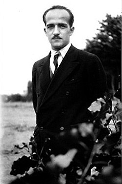 Portrait of a young Borduas wearing a suit.