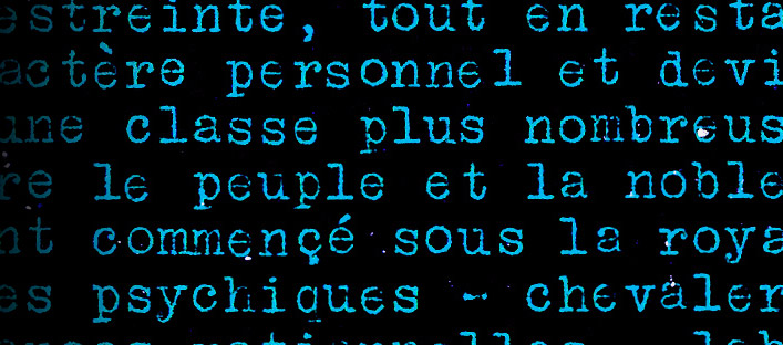 Inverted detail of a page from the manifesto. We can read words such as class, people, psychic and personal.