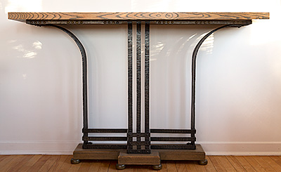 Wood and cast iron console table in the art deco style.